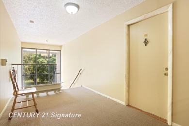 This top floor condo is located next to The Saginaw Country Club on Saginaw Country Club in Michigan - for sale on GolfHomes.com, golf home, golf lot