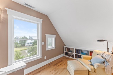 Coastal charm on one of the island's most iconic corners. At the on Bald Head Island Golf Club in North Carolina - for sale on GolfHomes.com, golf home, golf lot