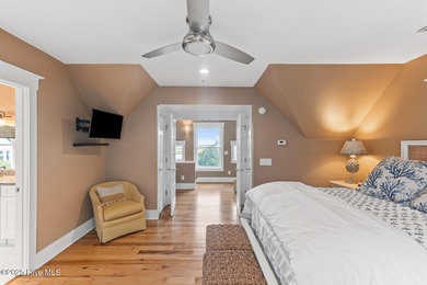 Coastal charm on one of the island's most iconic corners. At the on Bald Head Island Golf Club in North Carolina - for sale on GolfHomes.com, golf home, golf lot