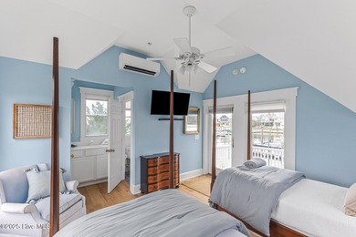 Coastal charm on one of the island's most iconic corners. At the on Bald Head Island Golf Club in North Carolina - for sale on GolfHomes.com, golf home, golf lot