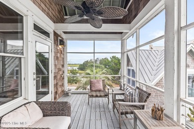 Coastal charm on one of the island's most iconic corners. At the on Bald Head Island Golf Club in North Carolina - for sale on GolfHomes.com, golf home, golf lot