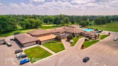 This top floor condo is located next to The Saginaw Country Club on Saginaw Country Club in Michigan - for sale on GolfHomes.com, golf home, golf lot