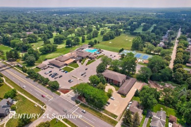 This top floor condo is located next to The Saginaw Country Club on Saginaw Country Club in Michigan - for sale on GolfHomes.com, golf home, golf lot