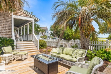 Coastal charm on one of the island's most iconic corners. At the on Bald Head Island Golf Club in North Carolina - for sale on GolfHomes.com, golf home, golf lot