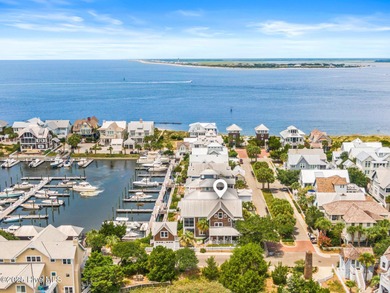 Coastal charm on one of the island's most iconic corners. At the on Bald Head Island Golf Club in North Carolina - for sale on GolfHomes.com, golf home, golf lot