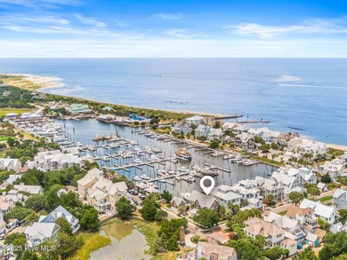 Coastal charm on one of the island's most iconic corners. At the on Bald Head Island Golf Club in North Carolina - for sale on GolfHomes.com, golf home, golf lot