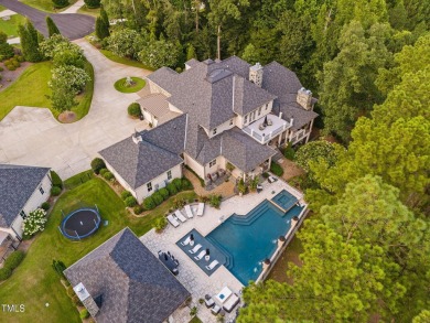 Welcome to an unparalleled sanctuary of luxury!  This on Hasentree Club in North Carolina - for sale on GolfHomes.com, golf home, golf lot