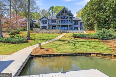COMPLETELY RENOVATED. REIMAGINED. PRACTICALLY REBUILT FROM THE on Great Waters Course At Reynolds Plantation in Georgia - for sale on GolfHomes.com, golf home, golf lot