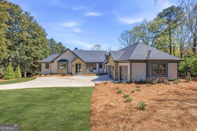 COMPLETELY RENOVATED. REIMAGINED. PRACTICALLY REBUILT FROM THE on Great Waters Course At Reynolds Plantation in Georgia - for sale on GolfHomes.com, golf home, golf lot