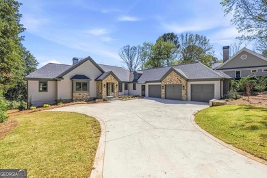 COMPLETELY RENOVATED. REIMAGINED. PRACTICALLY REBUILT FROM THE on Great Waters Course At Reynolds Plantation in Georgia - for sale on GolfHomes.com, golf home, golf lot