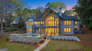 COMPLETELY RENOVATED. REIMAGINED. PRACTICALLY REBUILT FROM THE on Great Waters Course At Reynolds Plantation in Georgia - for sale on GolfHomes.com, golf home, golf lot