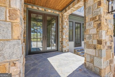 COMPLETELY RENOVATED. REIMAGINED. PRACTICALLY REBUILT FROM THE on Great Waters Course At Reynolds Plantation in Georgia - for sale on GolfHomes.com, golf home, golf lot