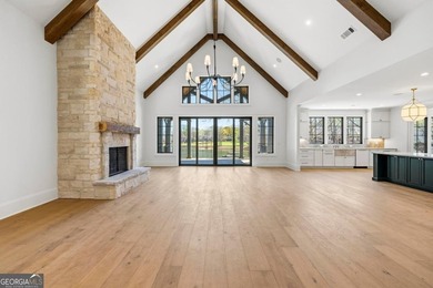 COMPLETELY RENOVATED. REIMAGINED. PRACTICALLY REBUILT FROM THE on Great Waters Course At Reynolds Plantation in Georgia - for sale on GolfHomes.com, golf home, golf lot