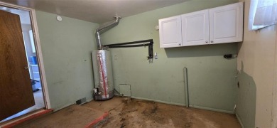 Located just two blocks from Hot Springs State Park and the on Legion Town And Country Club in Wyoming - for sale on GolfHomes.com, golf home, golf lot