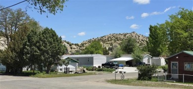 Located just two blocks from Hot Springs State Park and the on Legion Town And Country Club in Wyoming - for sale on GolfHomes.com, golf home, golf lot