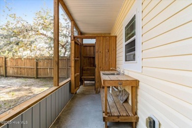 Experience the best of Oak Island living in this stunning piling on Founders Club At St. James Plantation in North Carolina - for sale on GolfHomes.com, golf home, golf lot