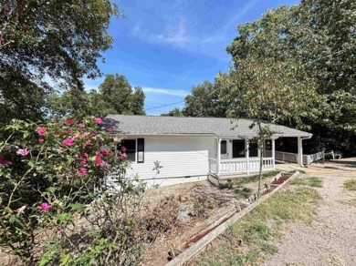 This well maintained home on 2 lots, has just been remodeled on Cherokee Village North Course in Arkansas - for sale on GolfHomes.com, golf home, golf lot