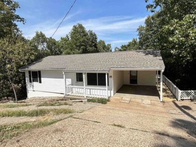 This well maintained home on 2 lots, has just been remodeled on Cherokee Village North Course in Arkansas - for sale on GolfHomes.com, golf home, golf lot