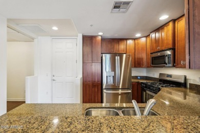Discover luxury living in this stunning top-floor Toscana condo on Wildfire Golf Club in Arizona - for sale on GolfHomes.com, golf home, golf lot
