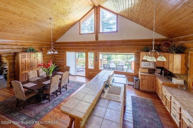 Escape to your own hand-hewn log retreat nestled in the woods of on Cedar Creek Golf Course in Wyoming - for sale on GolfHomes.com, golf home, golf lot