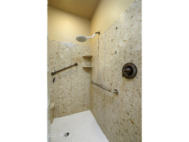 Sit on the north front patio and visit with friendly neighbors on Sunland Springs Golf Course  in Arizona - for sale on GolfHomes.com, golf home, golf lot