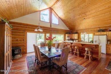 Escape to your own hand-hewn log retreat nestled in the woods of on Cedar Creek Golf Course in Wyoming - for sale on GolfHomes.com, golf home, golf lot