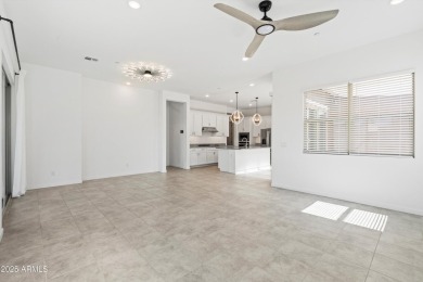 This stunning 3-bedroom, 2.5-bathroom home is nestled within a on Palm Valley Golf Club  in Arizona - for sale on GolfHomes.com, golf home, golf lot