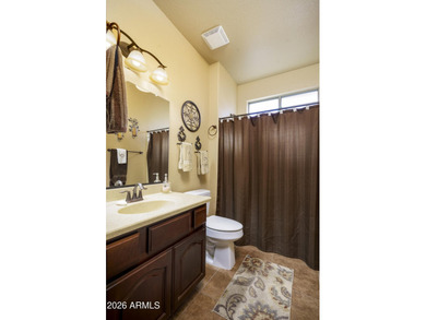 Sit on the north front patio and visit with friendly neighbors on Sunland Springs Golf Course  in Arizona - for sale on GolfHomes.com, golf home, golf lot