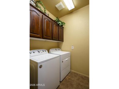 Sit on the north front patio and visit with friendly neighbors on Sunland Springs Golf Course  in Arizona - for sale on GolfHomes.com, golf home, golf lot