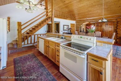 Escape to your own hand-hewn log retreat nestled in the woods of on Cedar Creek Golf Course in Wyoming - for sale on GolfHomes.com, golf home, golf lot