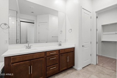 This stunning 3-bedroom, 2.5-bathroom home is nestled within a on Palm Valley Golf Club  in Arizona - for sale on GolfHomes.com, golf home, golf lot