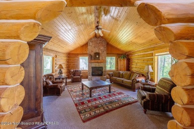 Escape to your own hand-hewn log retreat nestled in the woods of on Cedar Creek Golf Course in Wyoming - for sale on GolfHomes.com, golf home, golf lot