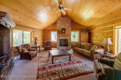 Escape to your own hand-hewn log retreat nestled in the woods of on Cedar Creek Golf Course in Wyoming - for sale on GolfHomes.com, golf home, golf lot