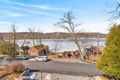 Perched high above Lake Mohawk on coveted Birch Parkway, this on Lake Mohawk Golf Club in New Jersey - for sale on GolfHomes.com, golf home, golf lot