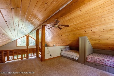 Escape to your own hand-hewn log retreat nestled in the woods of on Cedar Creek Golf Course in Wyoming - for sale on GolfHomes.com, golf home, golf lot