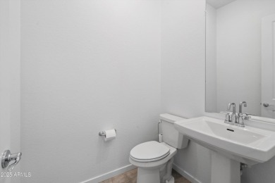 This stunning 3-bedroom, 2.5-bathroom home is nestled within a on Palm Valley Golf Club  in Arizona - for sale on GolfHomes.com, golf home, golf lot