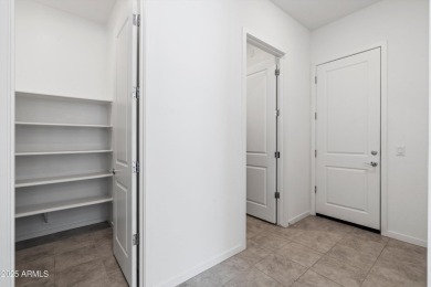This stunning 3-bedroom, 2.5-bathroom home is nestled within a on Palm Valley Golf Club  in Arizona - for sale on GolfHomes.com, golf home, golf lot