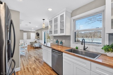 Perched high above Lake Mohawk on coveted Birch Parkway, this on Lake Mohawk Golf Club in New Jersey - for sale on GolfHomes.com, golf home, golf lot