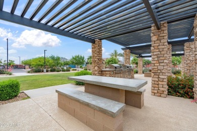 This stunning 3-bedroom, 2.5-bathroom home is nestled within a on Palm Valley Golf Club  in Arizona - for sale on GolfHomes.com, golf home, golf lot