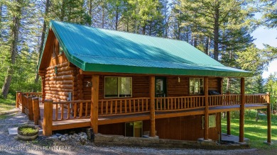 Escape to your own hand-hewn log retreat nestled in the woods of on Cedar Creek Golf Course in Wyoming - for sale on GolfHomes.com, golf home, golf lot