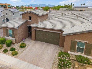 This stunning 3-bedroom, 2.5-bathroom home is nestled within a on Palm Valley Golf Club  in Arizona - for sale on GolfHomes.com, golf home, golf lot