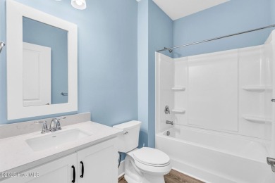 Welcome to 9246 Crossbill Dr. - a beautifully designed 4-bedroom on Cape Fear National At Brunswick Forest in North Carolina - for sale on GolfHomes.com, golf home, golf lot