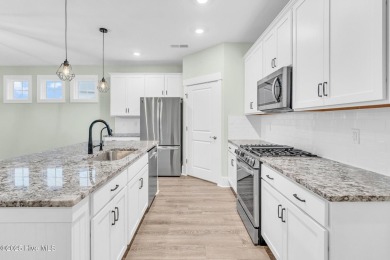 Welcome to 9246 Crossbill Dr. - a beautifully designed 4-bedroom on Cape Fear National At Brunswick Forest in North Carolina - for sale on GolfHomes.com, golf home, golf lot