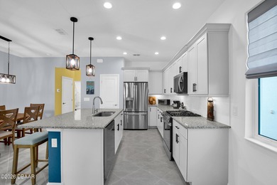 Step into this NEWER beautifully maintained , barely lived in on LPGA International Golf Course in Florida - for sale on GolfHomes.com, golf home, golf lot