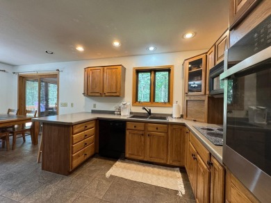 Tucked back on a nicely wooded lot, this TIMBER RIDGE home on Timber Ridge Golf Club in Wisconsin - for sale on GolfHomes.com, golf home, golf lot