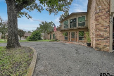 Nestled directly on the scenic Golf Course in Hideaway, this on Hide-A-Way Lake Golf Course in Texas - for sale on GolfHomes.com, golf home, golf lot