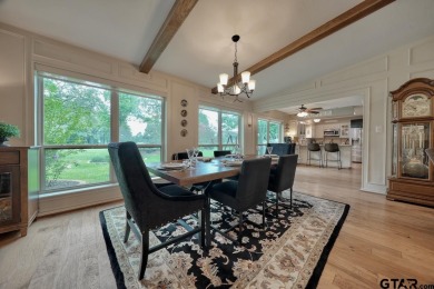 Nestled directly on the scenic Golf Course in Hideaway, this on Hide-A-Way Lake Golf Course in Texas - for sale on GolfHomes.com, golf home, golf lot