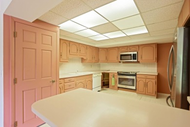 This top floor condo is located next to The Saginaw Country Club on Saginaw Country Club in Michigan - for sale on GolfHomes.com, golf home, golf lot