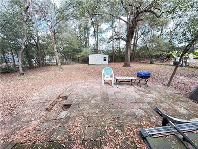 Centrally located this 4 bedroom 2 bath brick home offers on  in AL - for sale on GolfHomes.com, golf home, golf lot