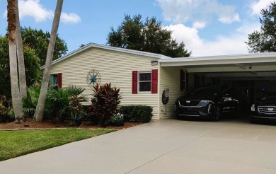 This lovely 3-bedroom, 2-bathroom manufactured home is located on Crane Lakes Golf and Country Club in Florida - for sale on GolfHomes.com, golf home, golf lot